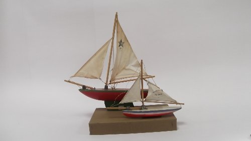 Appraisal: Two wooden yachts with sails cm and cm wide