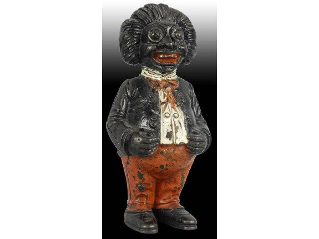 Appraisal: Cast Iron Golliwog Still Bank Description Made by John Harper