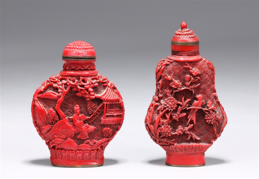 Appraisal: Two Chinese cinnabar like snuff bottles scene of figures amidst