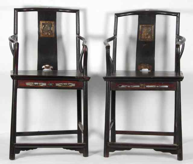 Appraisal: A pair of Oriental fruitwood chairs the vertical splats each