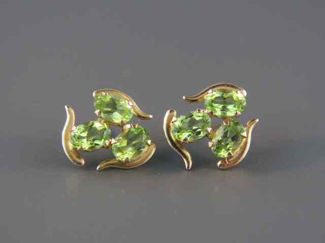 Appraisal: Peridot Earrings each with a trio of rich oval gems