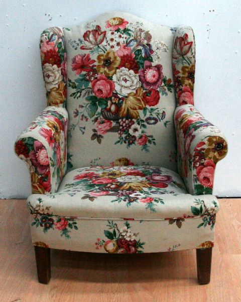 Appraisal: A chintz upholstered wingback armchair