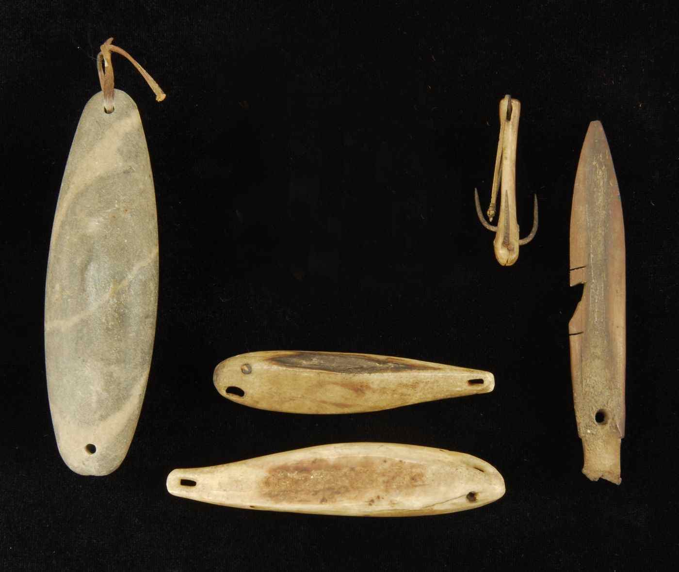 Appraisal: FIVE INUIT FISHING OR HUNTING IMPLEMENTS th CenturyTwo small bone