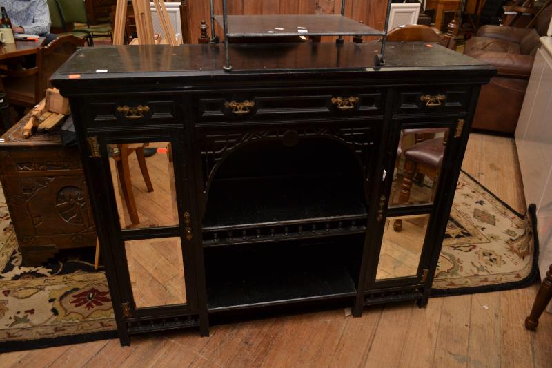 Appraisal: A SMALL EDWARDIAN EBONISED SIDEBAORD WITH BEVELLED MIRROR FRONT A