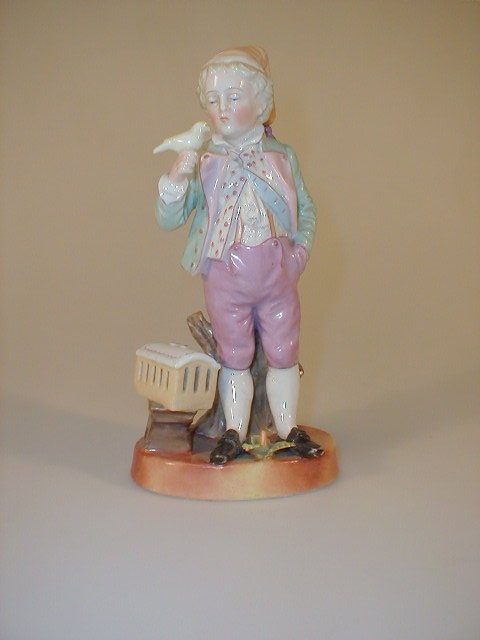 Appraisal: A German porcelain figure of a young boy wearing a