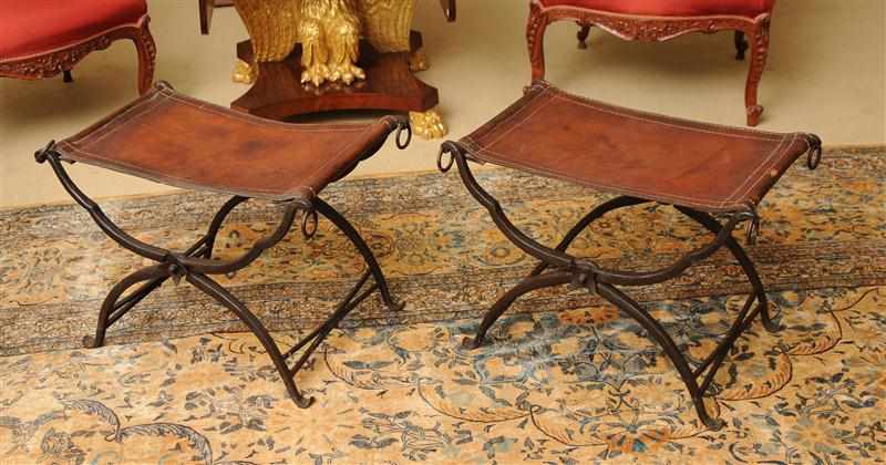 Appraisal: PAIR OF WROUGHT-IRON AND LEATHER FOLDING CURULE STOOLS POSSIBLY MORGAN