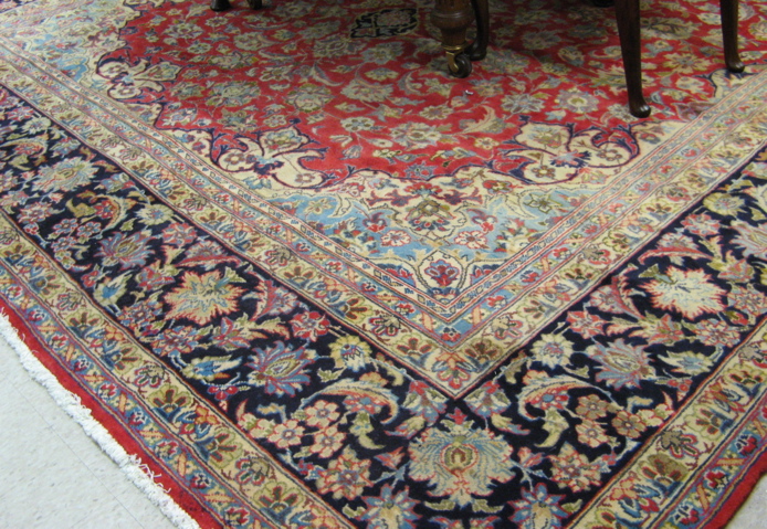 Appraisal: PERSIAN KASHAN CARPET floral and central floral medallion design on