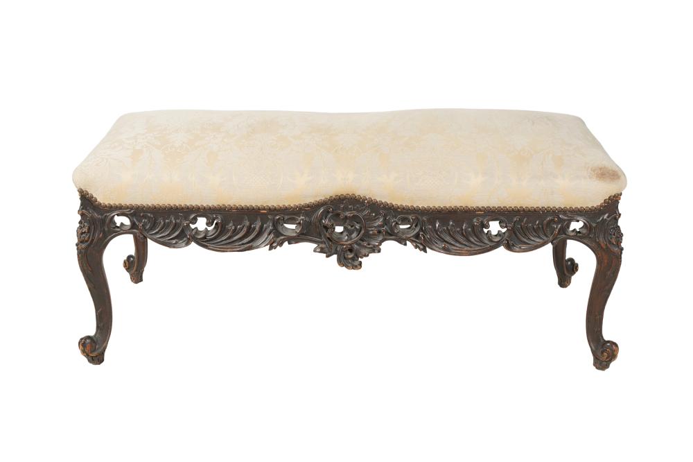 Appraisal: LOUIS XV-STYLE CARVED BENCHcovered with cream or pale yellow damask