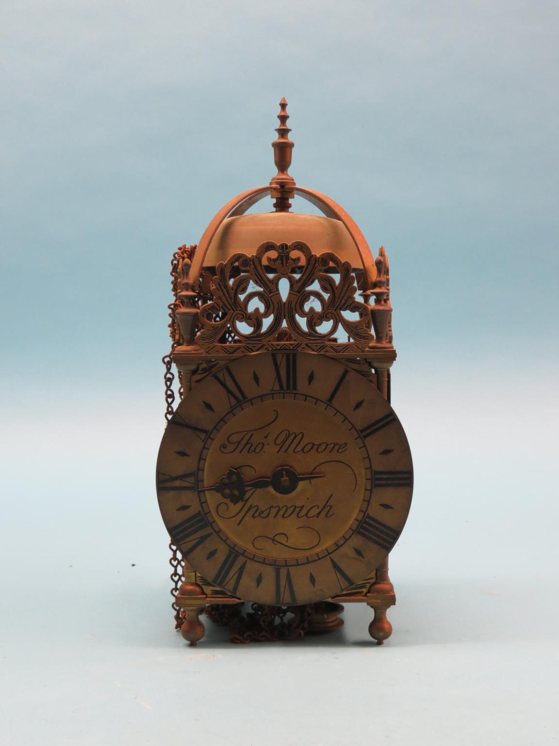 Appraisal: An old reproduction lantern clock in brass dial signed Thos