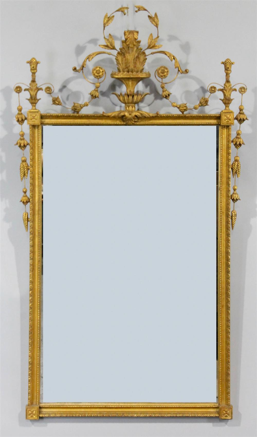 Appraisal: CLASSICAL STYLE GILTWOOD MIRROR WITH URN PEDIMENT having an urn