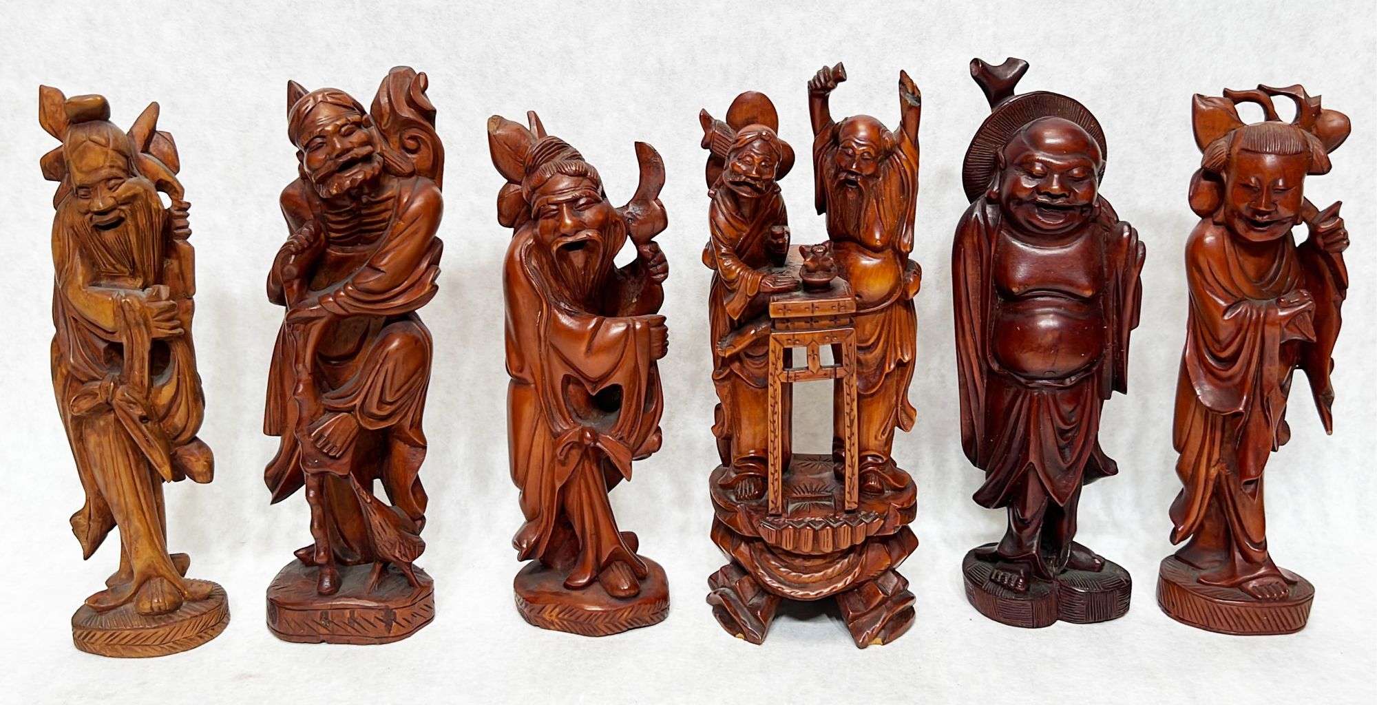 Appraisal: Chinese carved wood figuresTallest stands in height Chips to figure