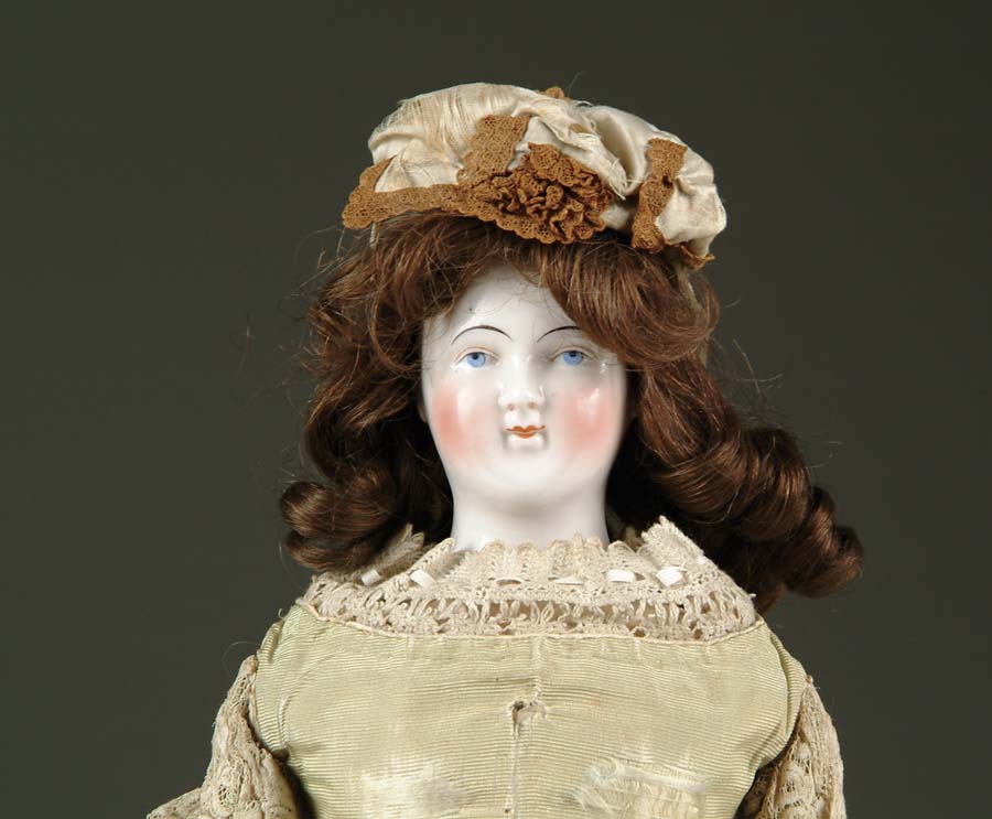 Appraisal: GLAZED CHINA SHOULDER HEAD DOLL Painted features with black painted