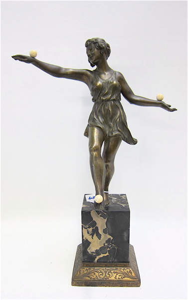 Appraisal: ART DECO BRONZE FIGURE dancer balancing ivory balls one foot