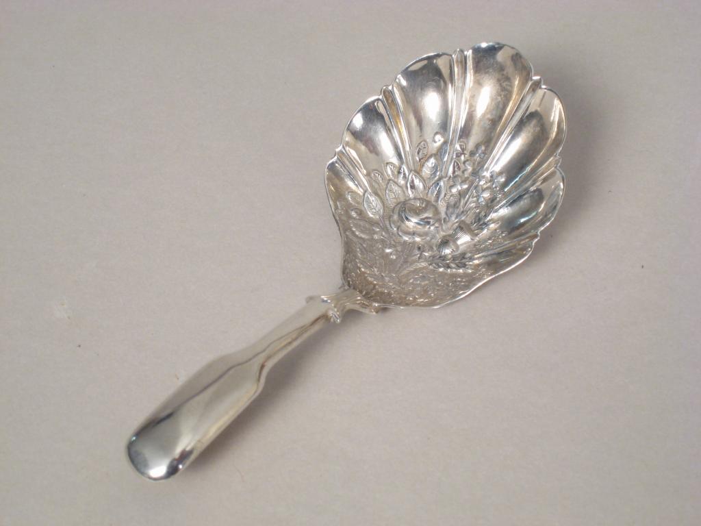 Appraisal: A George III Caddy Spoon fiddle pattern with floral embossed