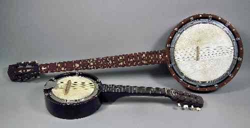 Appraisal: A five string banjo in oak finish case ins overall