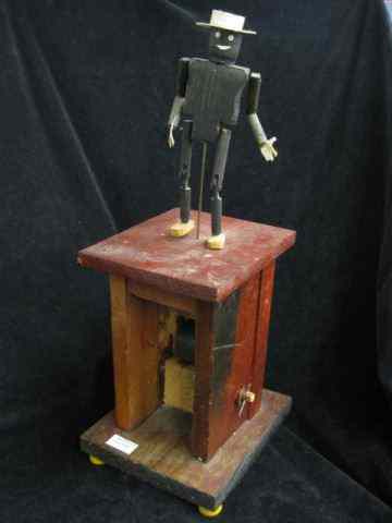 Appraisal: Folk Art Mechanical Wooden Toy of Black ManDancing hand crank