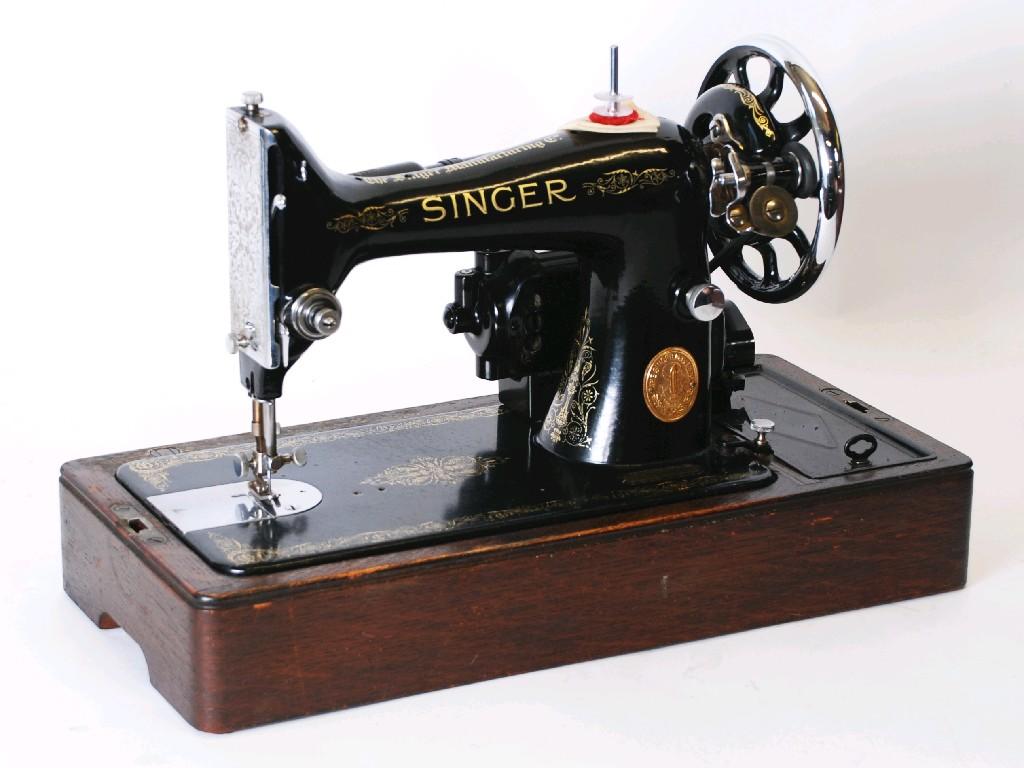 Appraisal: EARLY TWENTIETH CENTURY 'GAMAGES' BLACK JAPANNED METAL PORTABLE SEWING MACHINE