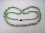 Appraisal: A graduated jade bead necklace largest bead approx mm diameter