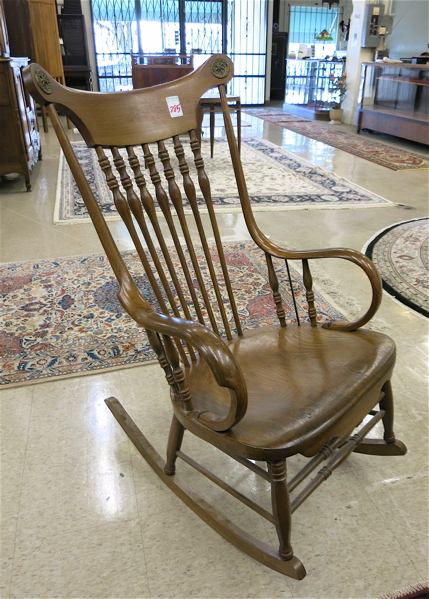 Appraisal: ANTIQUE ROCKING CHAIR American th century having a turned spindle