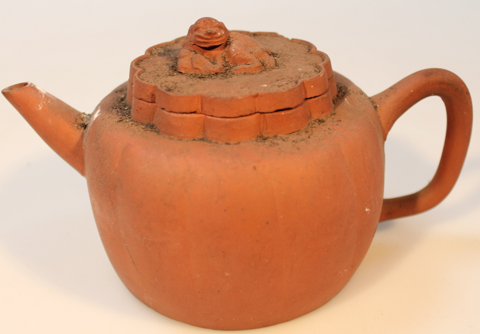 Appraisal: A Chinese Yixing style redware teapot the squat bulbous body