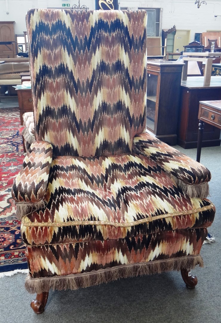 Appraisal: A large pair of th century square back open armchairs