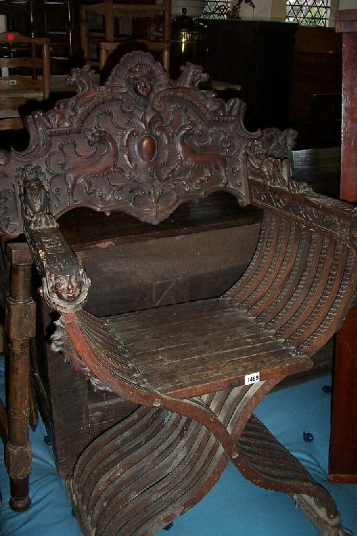 Appraisal: A th century Spanish walnut armchair with X-shaped framework with