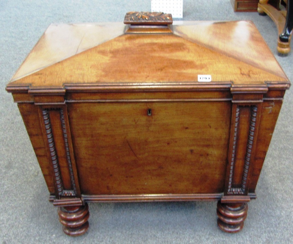 Appraisal: A George II mahogany sarcophagus wine cooler on turned supports