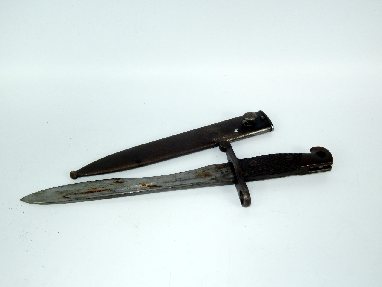 Appraisal: A Spanish bow bayonet serial number sheathed