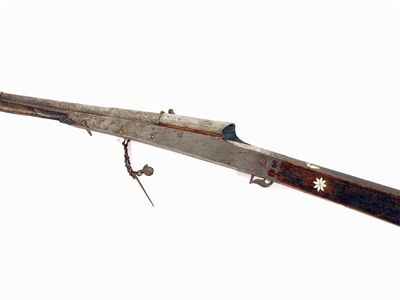 Appraisal: An eastern match lock rifle the damascene barrel stamped script