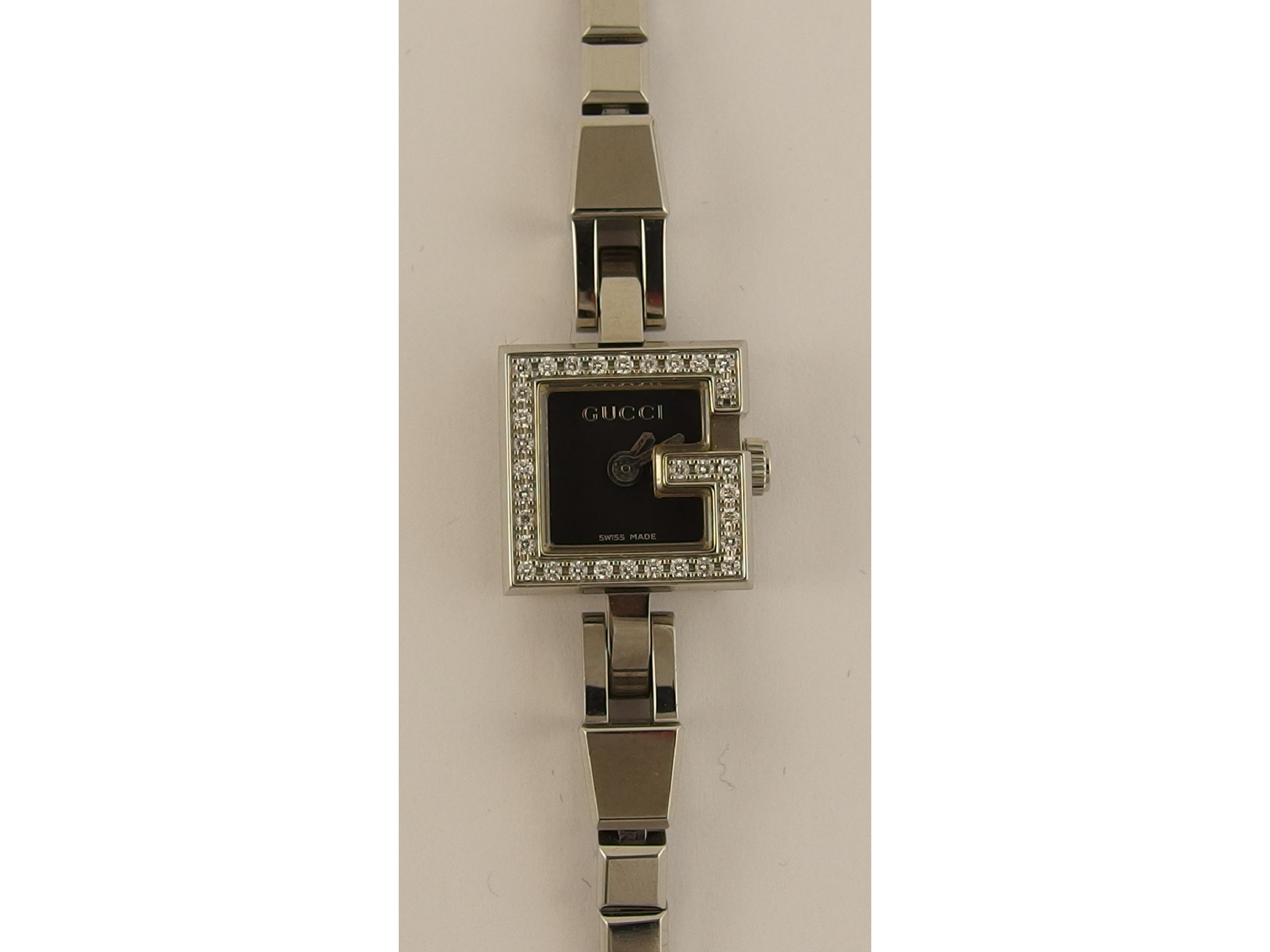 Appraisal: A ladies 'G' Gucci watchwith a black dial silver coloured