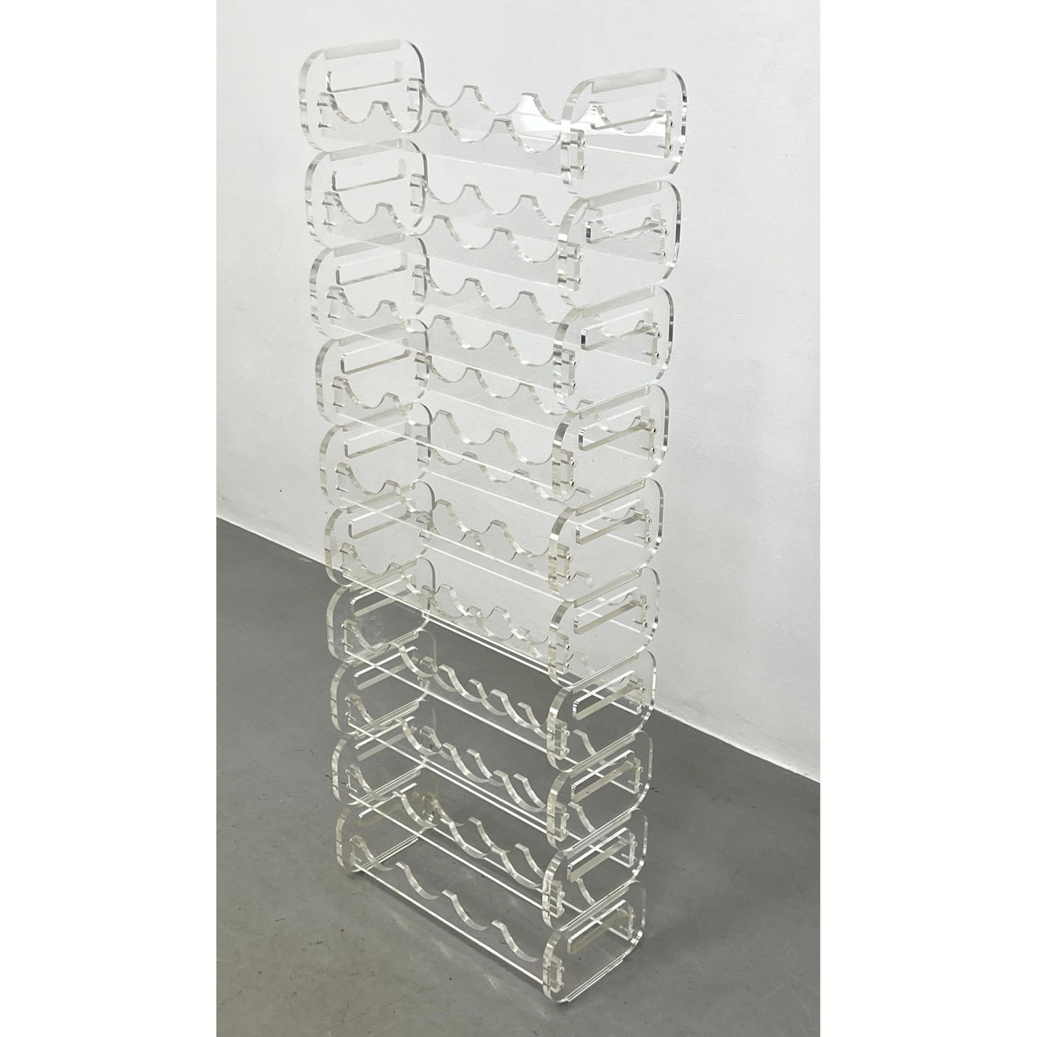 Appraisal: Stackable Lucite Wine Racks Interchangeable bottle holder Lucite shelf Each