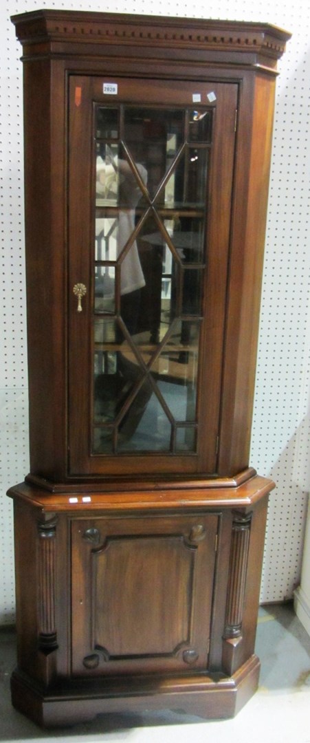 Appraisal: A th century hardwood floor standing corner cabinet