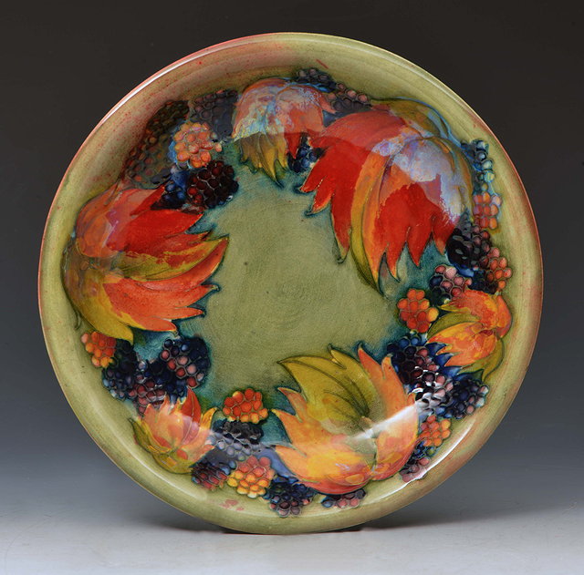 Appraisal: William Moorcroft British - 'Leaf and Berry' flambe dish circa