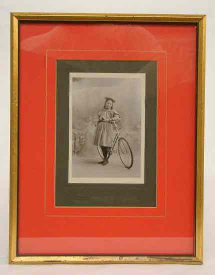 Appraisal: Photograph of a young lady and her safety bicycle with