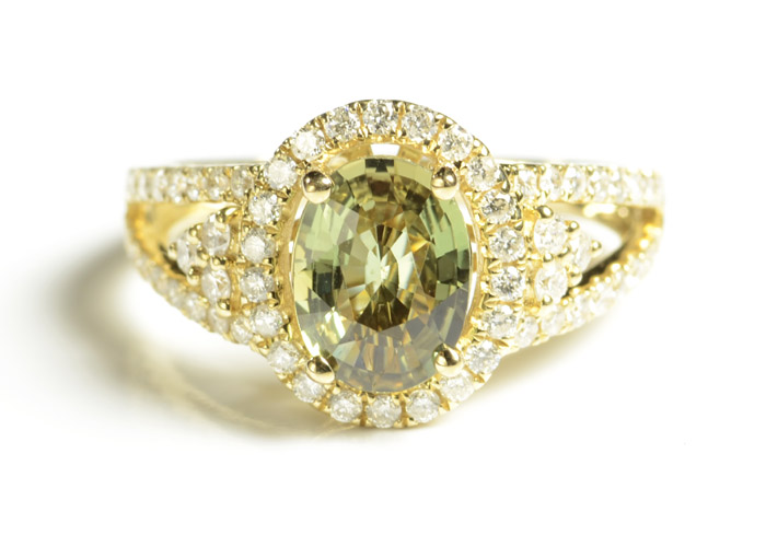 Appraisal: GREEN SAPPHIRE AND DIAMOND RING k yellow gold with round-cut