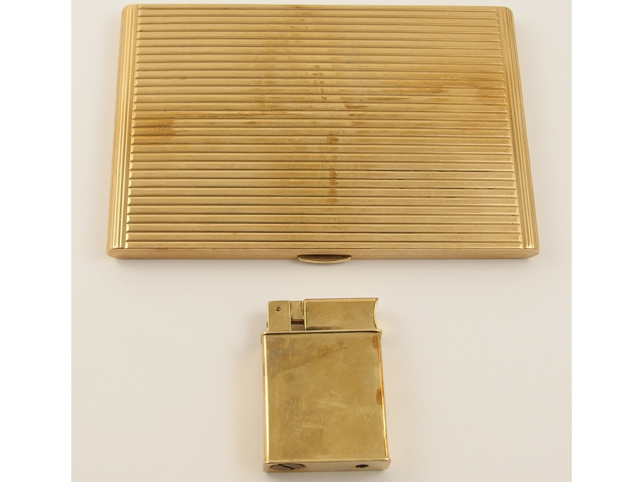 Appraisal: A ct reeded pattern cigarette case and a ct lighterthe