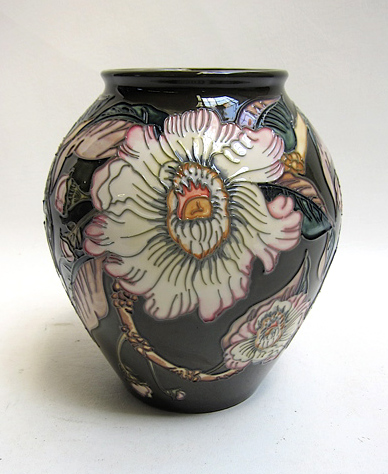 Appraisal: MOORCROFT POTTERY VASE hand painted under glaze with a floral