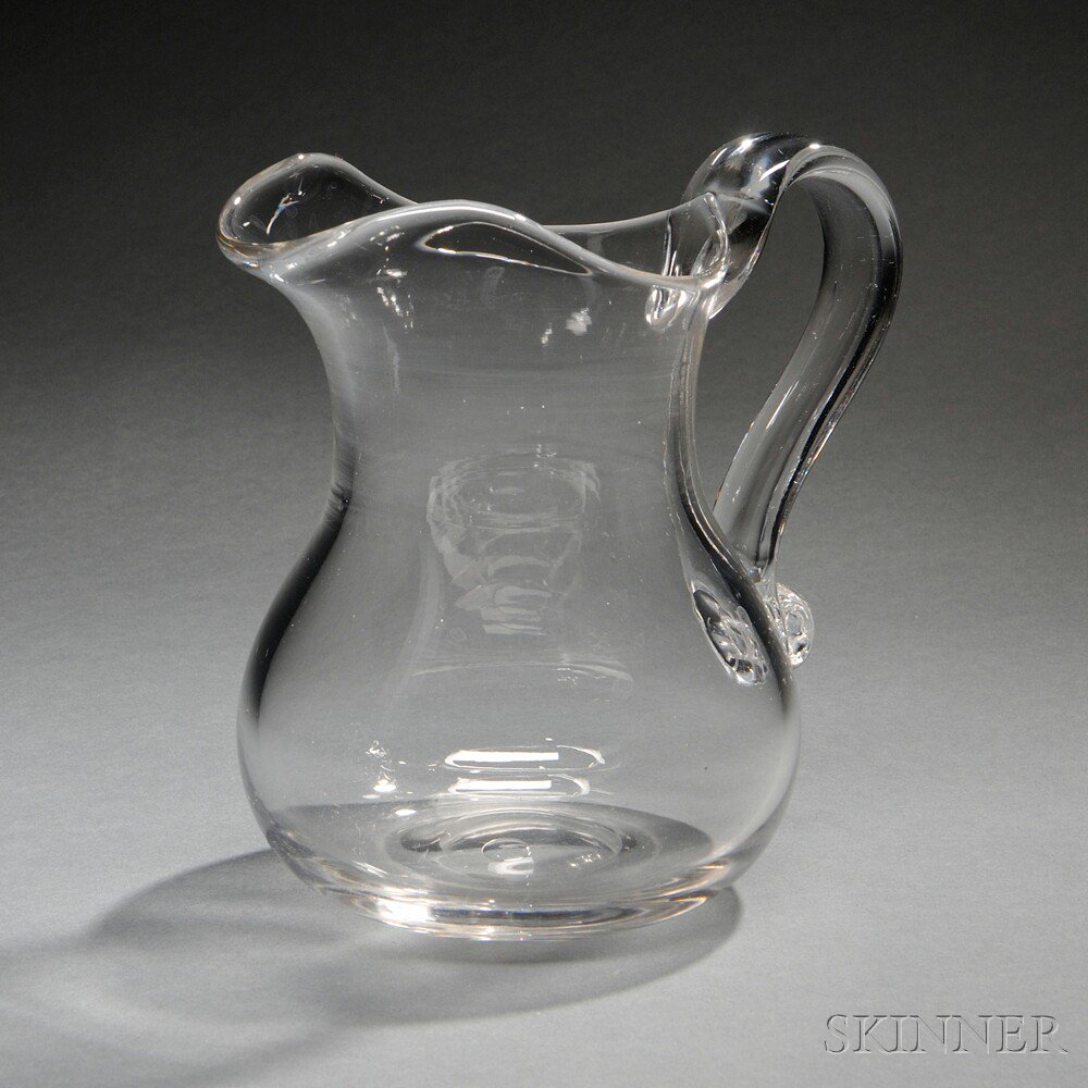 Appraisal: Colorless Blown Glass Pitcher th century baluster-form with ear-shaped handle