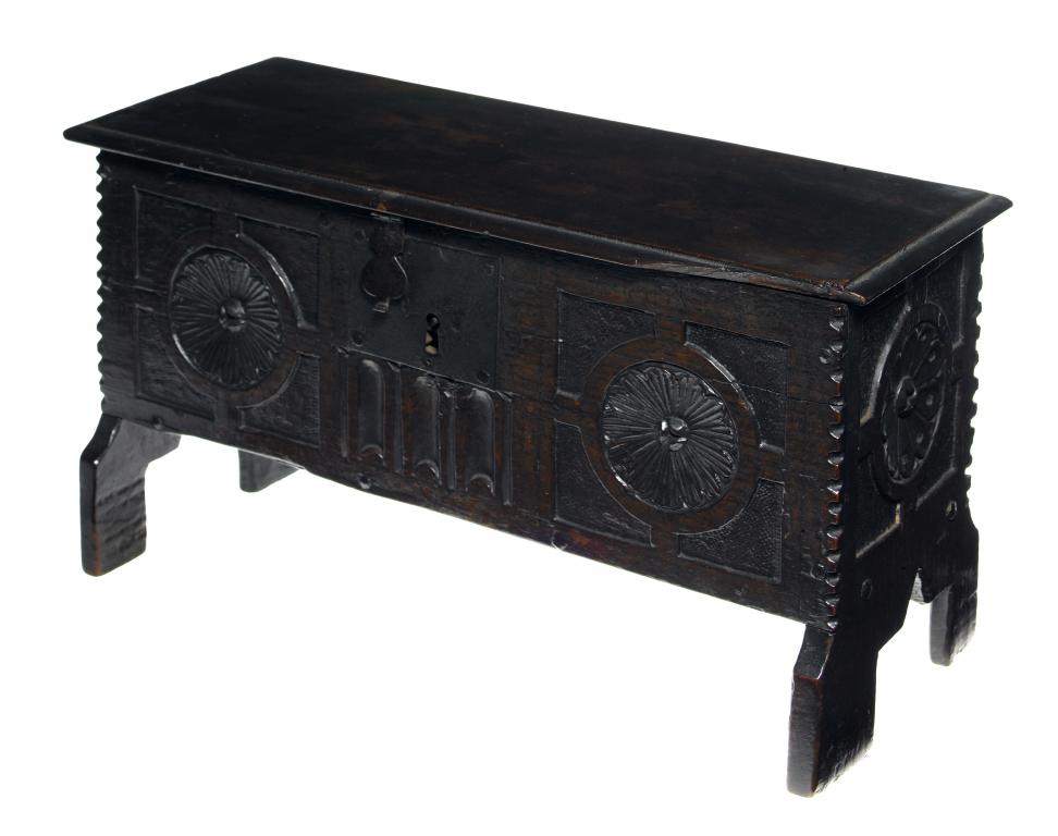 Appraisal: AN OAK MINIATURE CHEST the front carved with two flowerheads