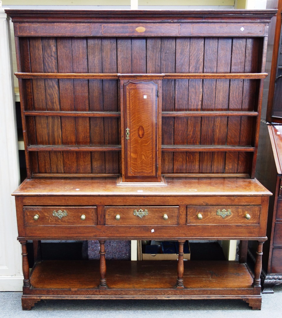 Appraisal: An inlaid George III oak dresser the enclosed three tier