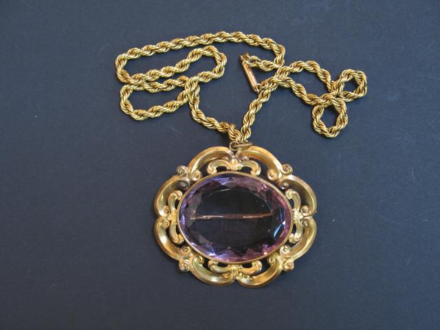 Appraisal: A LARGE OVAL CUSHION-CUT AMETHYST set as a brooch pendant