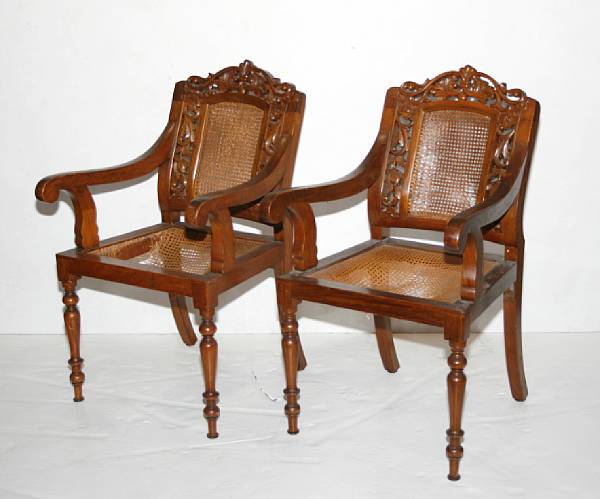 Appraisal: A pair of Asian export Rococo style carved mahogany armchairs