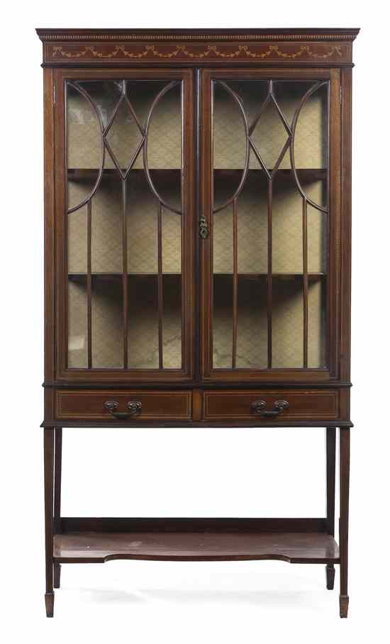 Appraisal: A Georgian Style Vitrine Cabinet having a molded cornice and