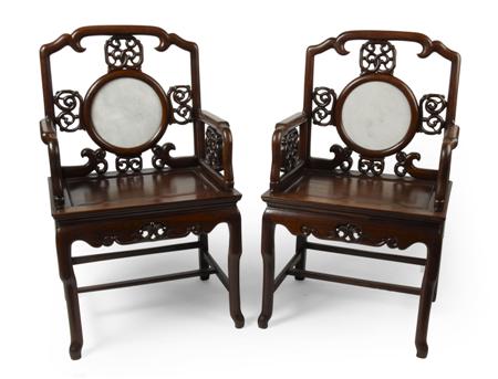 Appraisal: PAIR OF CHINESE CARVED HARDWOOD ARMCHAIRS SECOND HALF OF THE