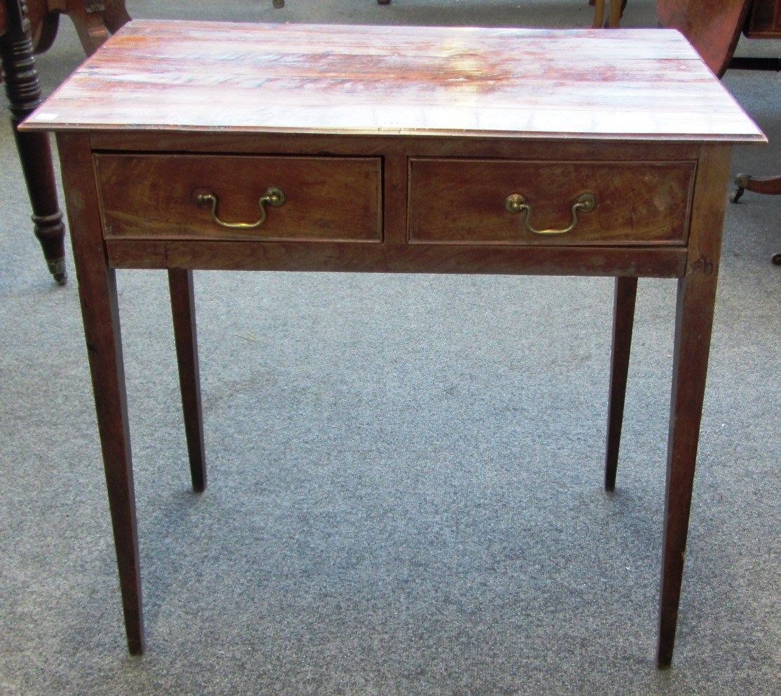 Appraisal: An th century fruit wood two drawer side table on