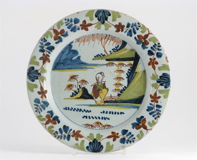 Appraisal: A Delftware plate probably London painted in polychrome enamels with