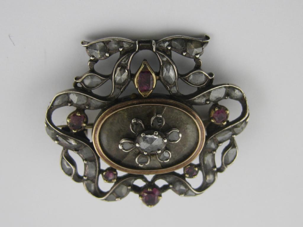 Appraisal: A floral basket Brooch set paste a trophy Brooch set