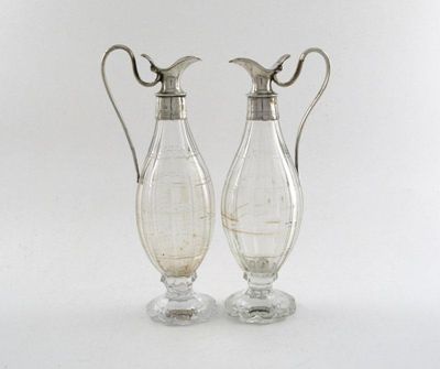 Appraisal: A pair of mounted glass oil and vinegar bottles reeded