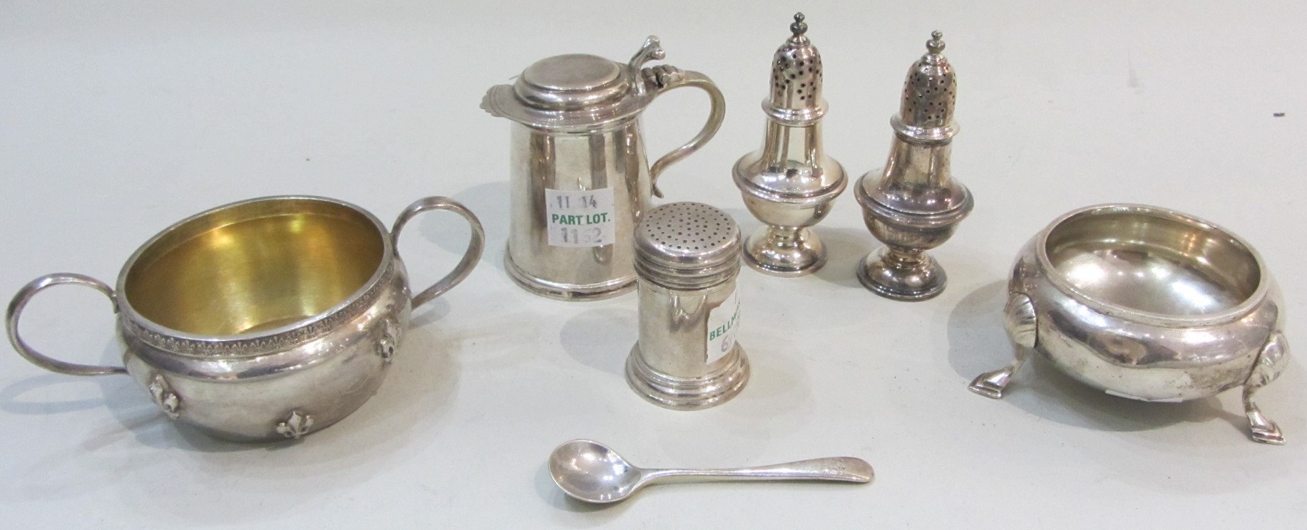 Appraisal: Silver comprising a pair of baluster shaped pepperettes Birmingham a