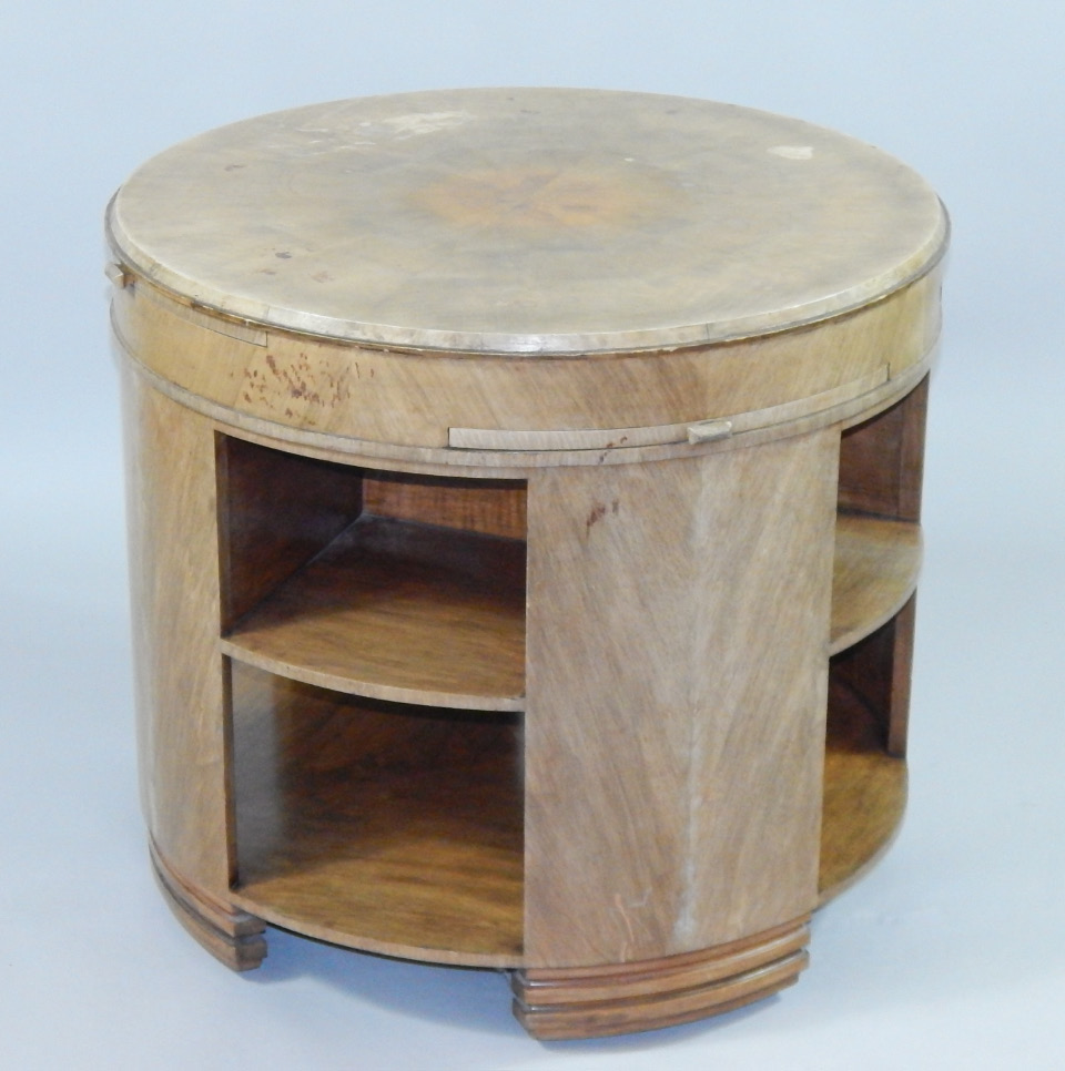 Appraisal: An Art Deco walnut drum library bookcase the circular top